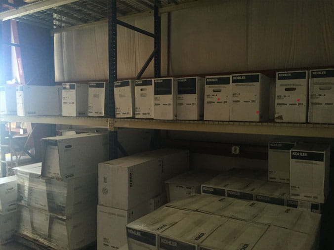 Boxes of plumbing parts stacked in the Dahl Greeley warehouse